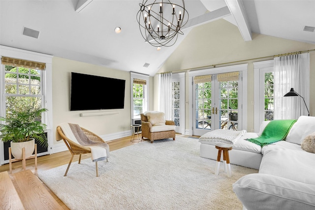 33 Fernwood Rd, Larchmont, NY 10538 - living room with beamed ceiling, an inviting chandelier, visible vents, french doors, and wood finished floors