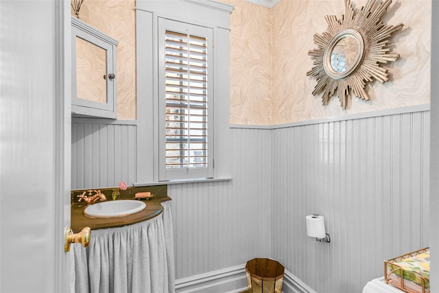 33 Fernwood Rd, Larchmont, NY 10538 - bathroom with wallpapered walls, a sink, and a healthy amount of sunlight