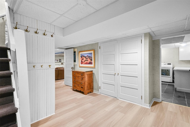 33 Fernwood Rd, Larchmont, NY 10538 - hallway featuring baseboards, washer / dryer, wood finished floors, and a drop ceiling