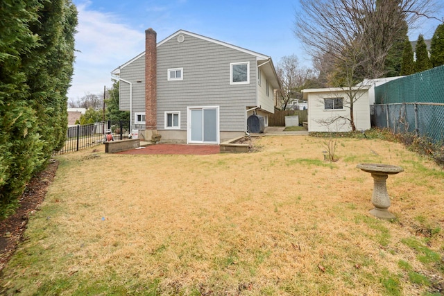 161 Cherry St, Northport, NY 11768 - rear view of property featuring a chimney and a patio