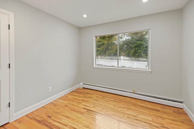 161 Cherry St, Northport, NY 11768 - empty room featuring baseboard heating, wood finished floors, recessed lighting, and baseboards