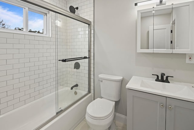 161 Cherry St, Northport, NY 11768 - full bathroom with toilet, shower / bath combination with glass door, vanity, and baseboards