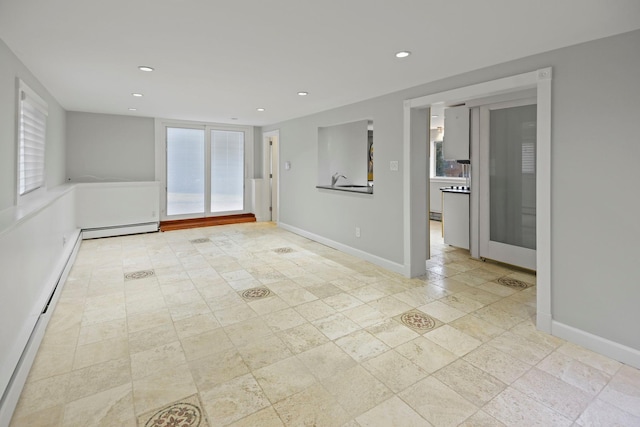 161 Cherry St, Northport, NY 11768 - unfurnished room featuring a baseboard radiator, plenty of natural light, recessed lighting, and baseboards