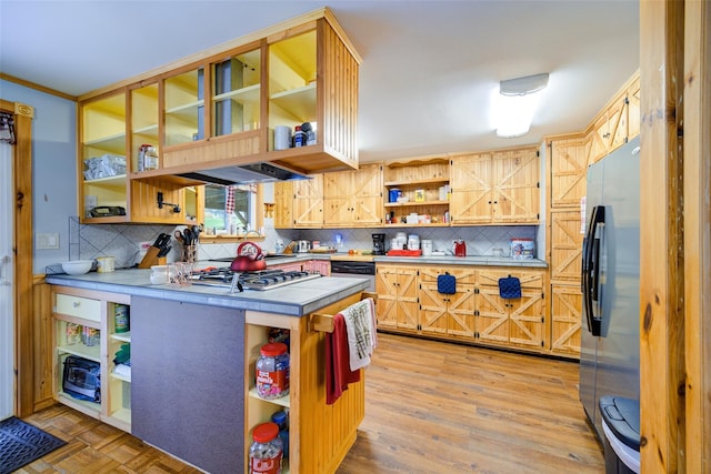 kitchen featuring tile counters, open shelves, freestanding refrigerator, and backsplash