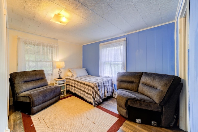 bedroom with wood finished floors