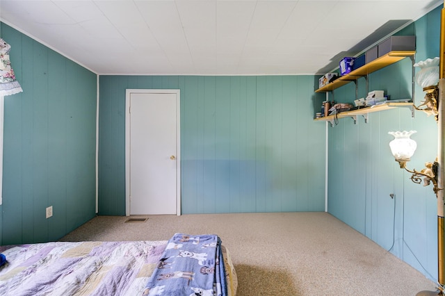 unfurnished bedroom with visible vents and carpet floors