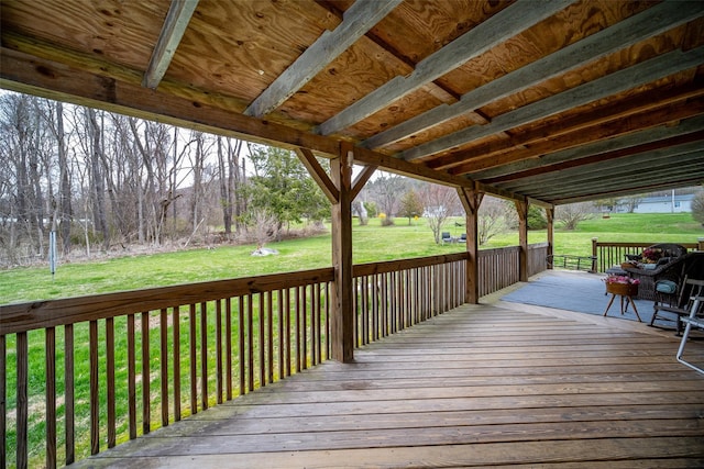 wooden deck with a lawn
