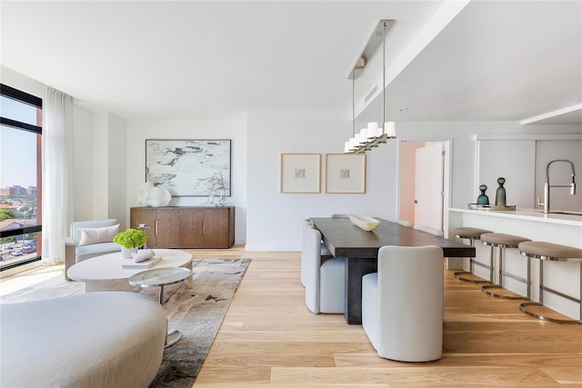 dining space featuring light wood-type flooring