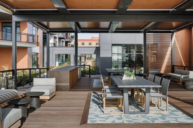 wooden terrace with an outdoor hangout area