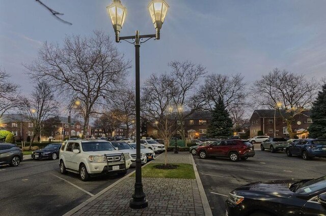 88-25 155th Ave Unit 6L, Howard Beach, NY 11414 - uncovered parking lot featuring a residential view