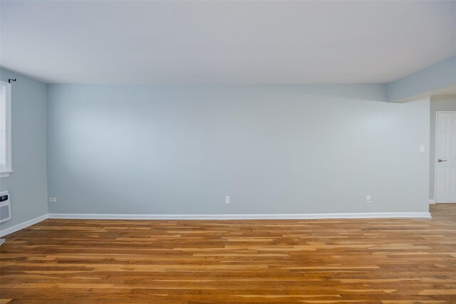 88-25 155th Ave Unit 6L, Howard Beach, NY 11414 - spare room with baseboards and wood finished floors