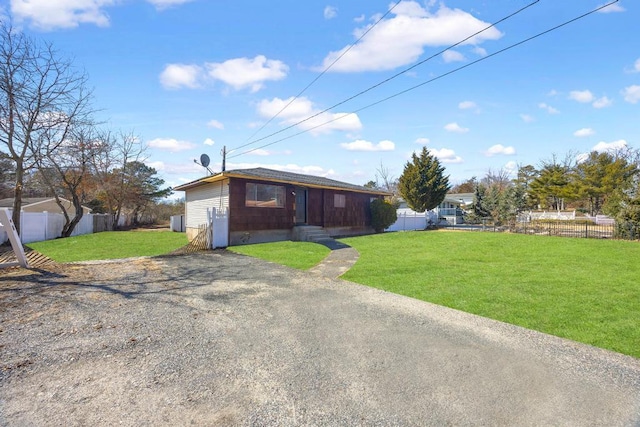 exterior space featuring entry steps, a yard, and fence