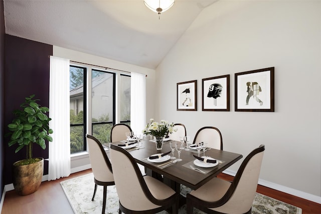 446 Heritage Hls Unit C, Somers, NY 10589 - dining area with wood finished floors, baseboards, and high vaulted ceiling