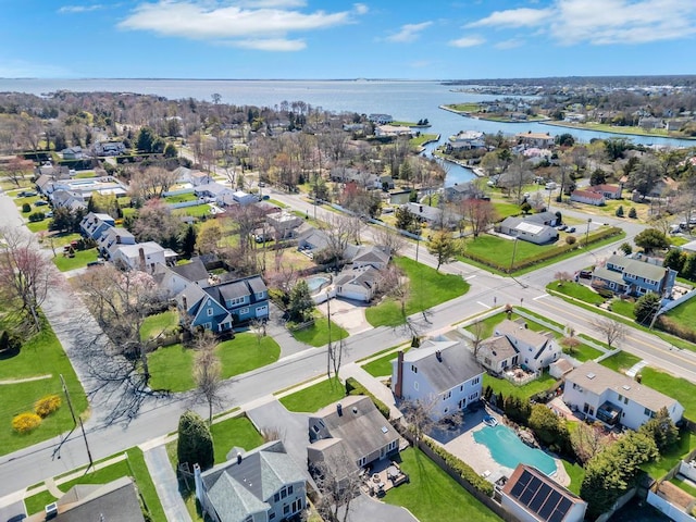 bird's eye view featuring a water view and a residential view
