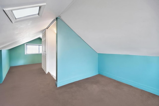 bonus room with carpet floors and lofted ceiling