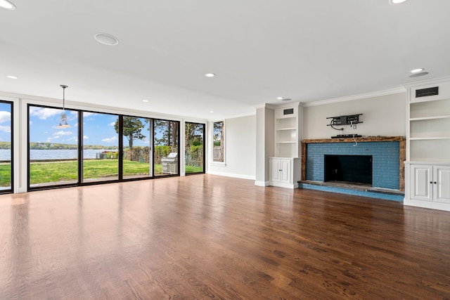 145 Asharoken Ave, Northport, NY 11768 - unfurnished living room with floor to ceiling windows, ornamental molding, built in shelves, and wood finished floors