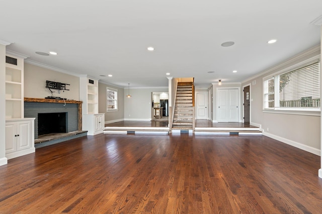 145 Asharoken Ave, Northport, NY 11768 - unfurnished living room with visible vents, crown molding, wood finished floors, and stairway