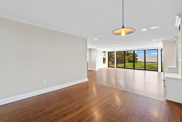 145 Asharoken Ave, Northport, NY 11768 - unfurnished living room with baseboards, ornamental molding, and wood finished floors