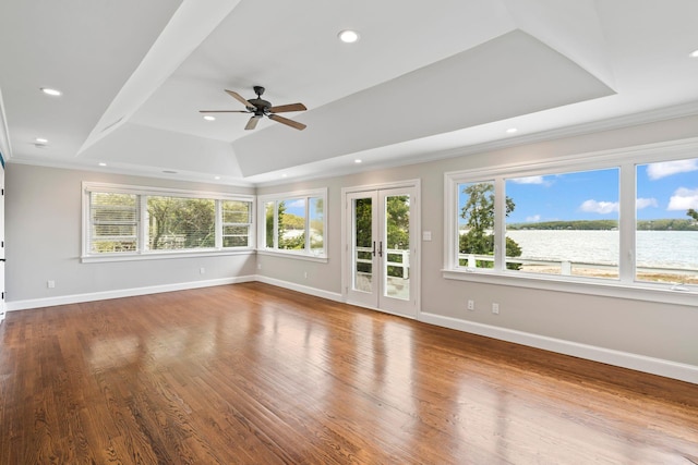 145 Asharoken Ave, Northport, NY 11768 - unfurnished living room featuring a tray ceiling, wood finished floors, baseboards, ceiling fan, and recessed lighting