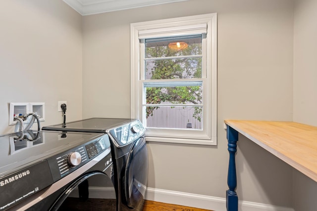145 Asharoken Ave, Northport, NY 11768 - washroom with baseboards, crown molding, washing machine and clothes dryer, and laundry area