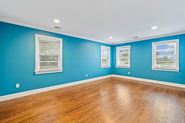 145 Asharoken Ave, Northport, NY 11768 - empty room with baseboards, visible vents, wood finished floors, and ornamental molding