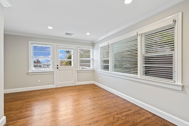 145 Asharoken Ave, Northport, NY 11768 - spare room featuring baseboards, light wood-style flooring, ornamental molding, and visible vents