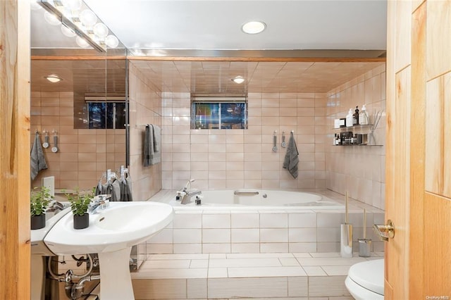 2872 Rosebud Ave, Merrick, NY 11566 - bathroom with tiled tub, tile walls, and toilet