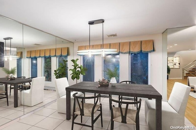 2872 Rosebud Ave, Merrick, NY 11566 - dining room with light tile patterned floors, visible vents, and stairway
