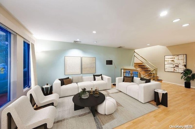2872 Rosebud Ave, Merrick, NY 11566 - living room featuring visible vents, wood finished floors, recessed lighting, stairway, and baseboards