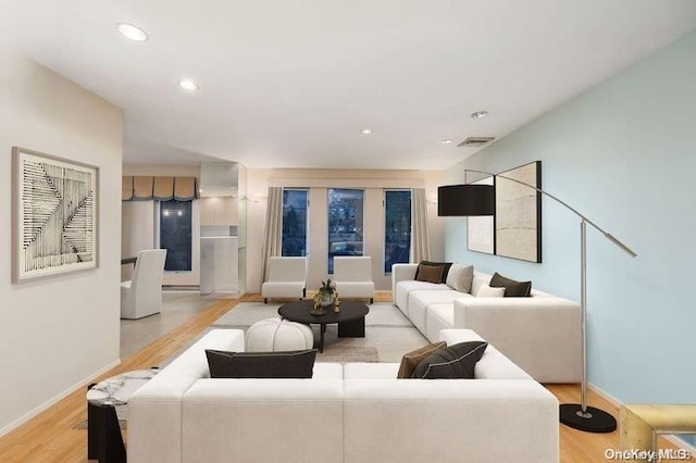 2872 Rosebud Ave, Merrick, NY 11566 - living area featuring visible vents, recessed lighting, light wood-style floors, and baseboards