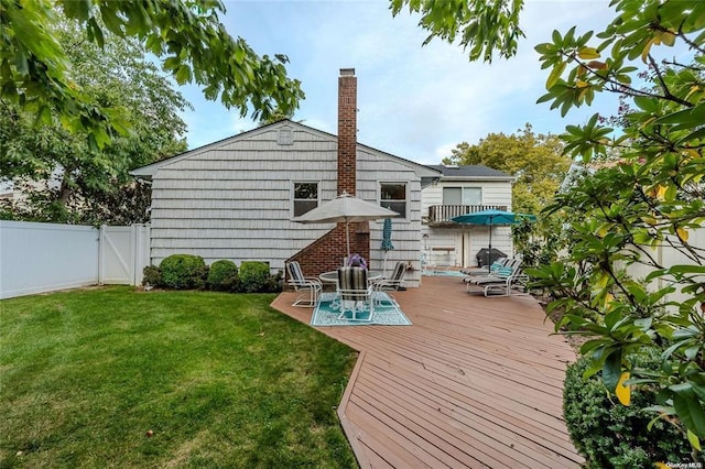 2872 Rosebud Ave, Merrick, NY 11566 - wooden deck with a gate, a yard, and fence