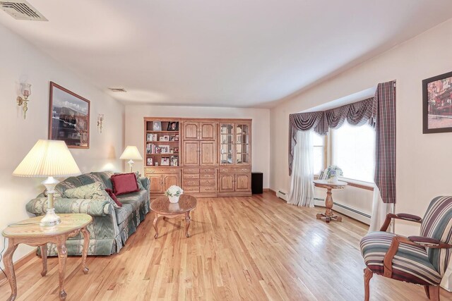 1 Mohawk Ct, Stony Point, NY 10980 - sitting room featuring a baseboard radiator, light wood-style flooring, and visible vents