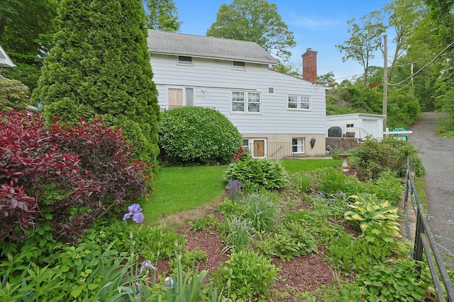 24 Burnsdale Ave, Valhalla, NY 10595 - back of property featuring a chimney and a yard