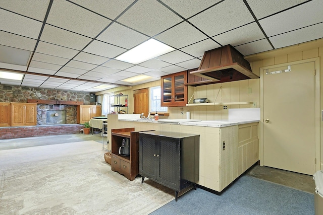 24 Burnsdale Ave, Valhalla, NY 10595 - kitchen featuring open shelves, light countertops, concrete flooring, a paneled ceiling, and glass insert cabinets