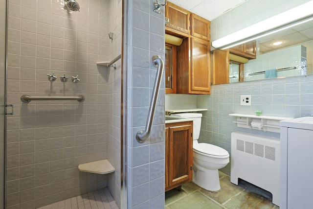 24 Burnsdale Ave, Valhalla, NY 10595 - bathroom with radiator, a stall shower, tile walls, toilet, and backsplash