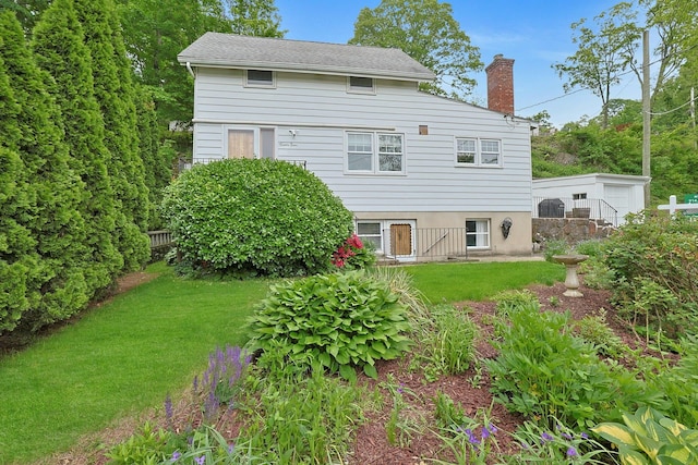 24 Burnsdale Ave, Valhalla, NY 10595 - back of house with a chimney