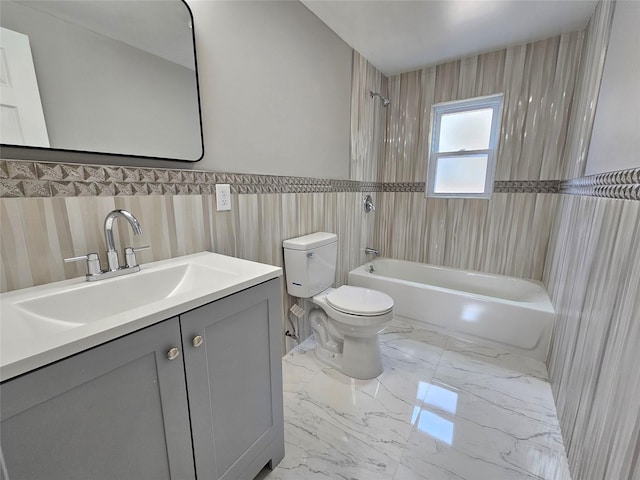 bathroom with vanity, shower / bath combination, tile walls, toilet, and marble finish floor
