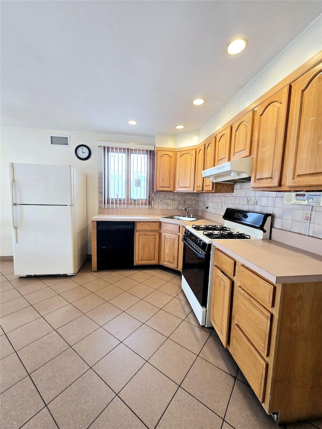159-42 81st St, Howard Beach, NY 11414 - kitchen with visible vents, freestanding refrigerator, black dishwasher, gas range, and under cabinet range hood