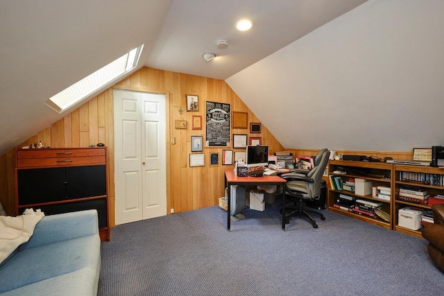 28 Rose Ave, Great Neck, NY 11021 - carpeted home office with lofted ceiling, a skylight, and wooden walls