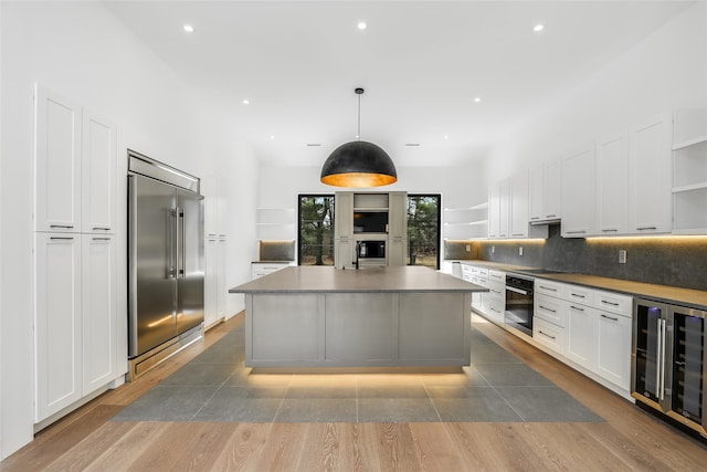 kitchen featuring open shelves, black appliances, decorative backsplash, white cabinets, and wine cooler