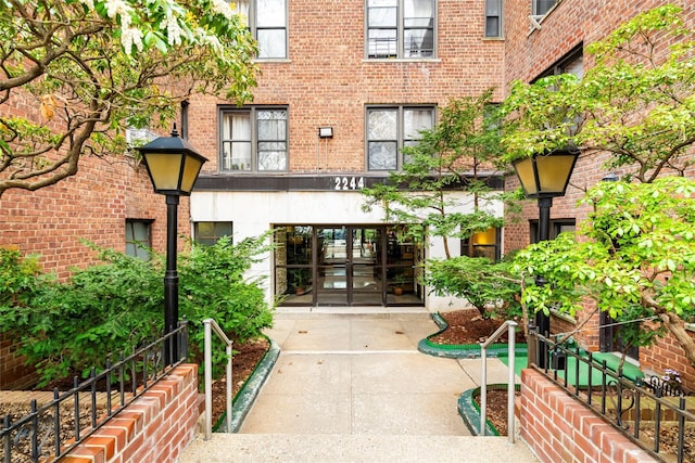 entrance to property with french doors and brick siding
