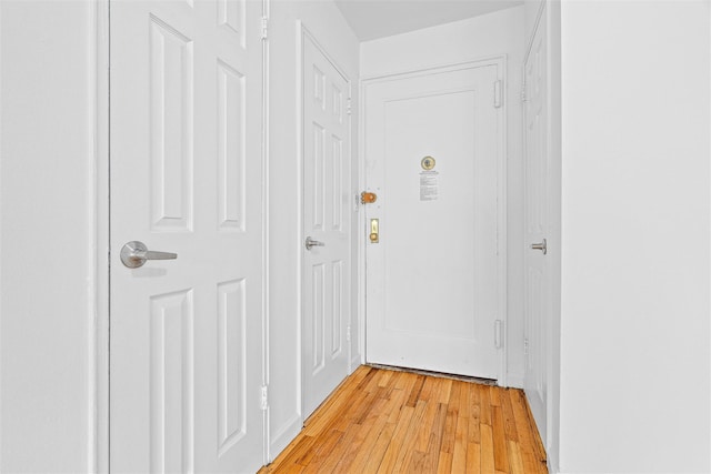 corridor featuring light wood-style floors