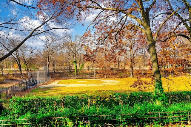 view of community with fence