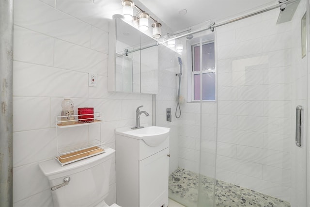 2750 Olinville Ave Unit 1K, Bronx, NY 10467 - full bathroom with toilet, tile walls, a shower stall, and vanity