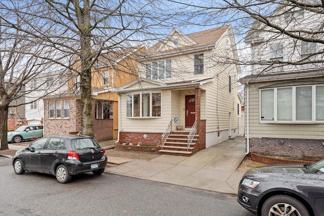 89-21 Aubrey Ave, Glendale, NY 11385 - view of front of house featuring entry steps and brick siding