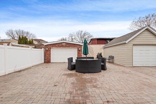 89-21 Aubrey Ave, Glendale, NY 11385 - garage with fence and decorative driveway