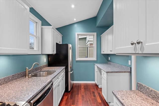 89-21 Aubrey Ave, Glendale, NY 11385 - kitchen with a sink, appliances with stainless steel finishes, dark wood-type flooring, white cabinetry, and lofted ceiling