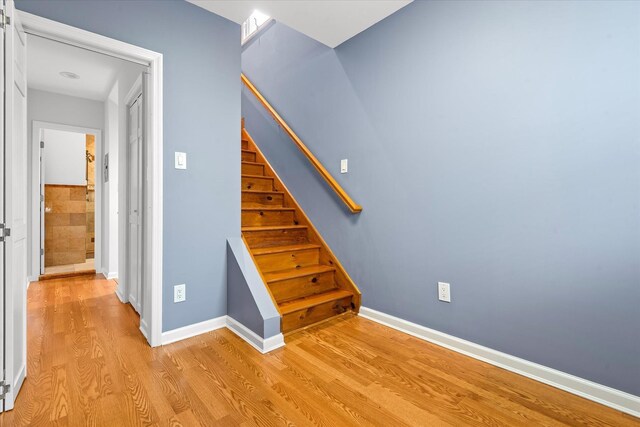 89-21 Aubrey Ave, Glendale, NY 11385 - stairs featuring wood finished floors and baseboards