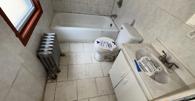 181-10 93rd Ave, Hollis, NY 11423 - full bathroom with a tub, tile walls, vanity, toilet, and radiator
