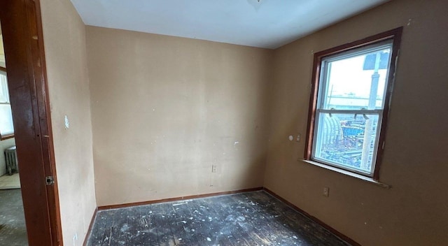 181-10 93rd Ave, Hollis, NY 11423 - unfurnished room with baseboards and radiator